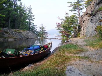 Portage over beaver dam - Killarney Provincial Park